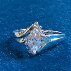 14K white gold ring, size 9, weighs over 5 grams.